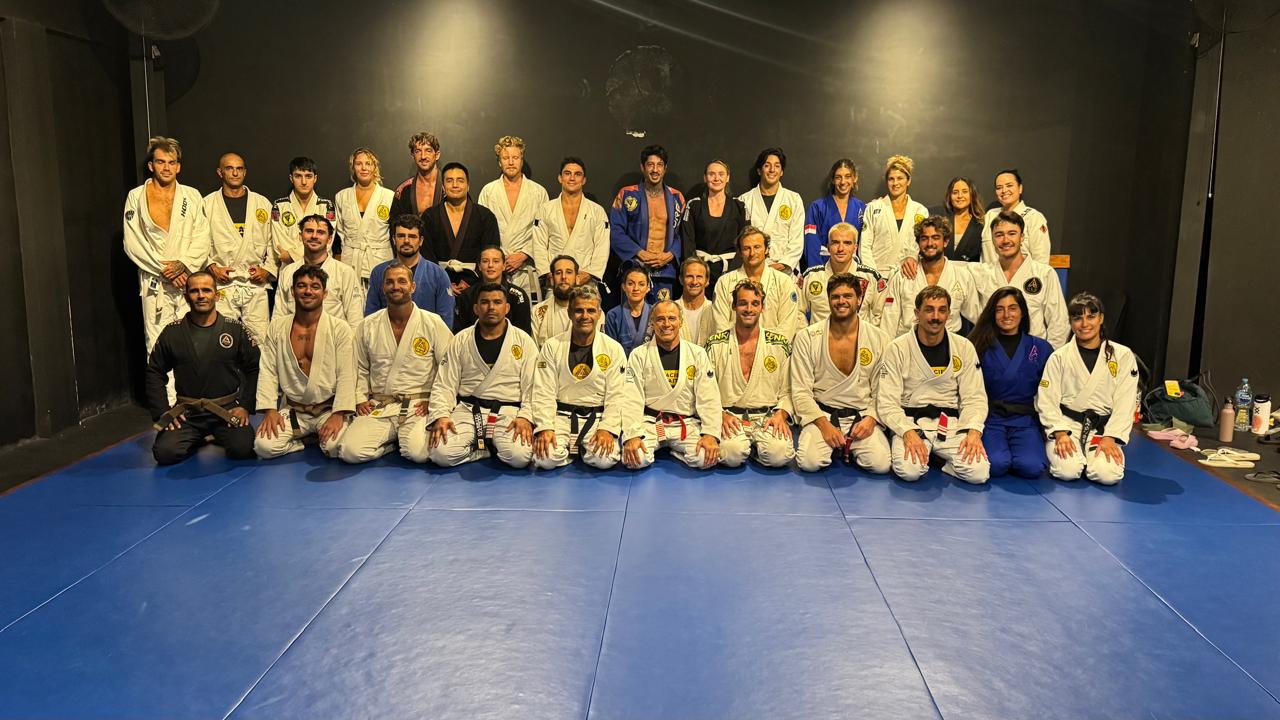 Large group of Brazilian Jiu Jitsu students posing together after class
