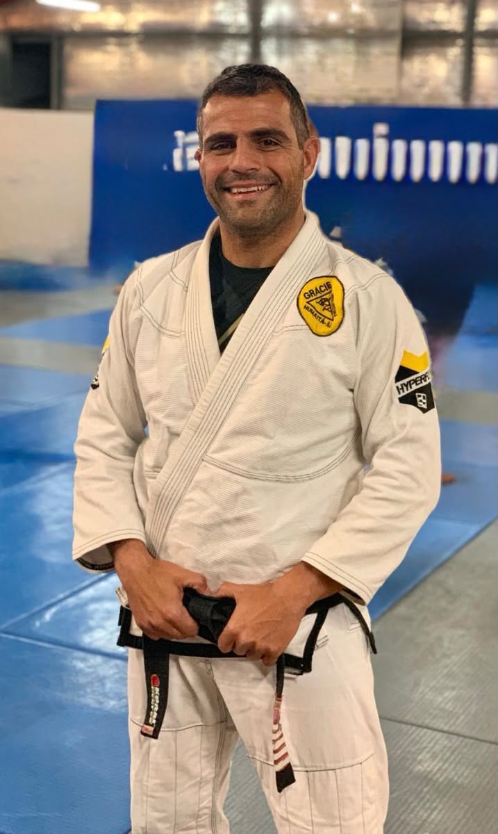 Bruno Panno holding his Brazilian Jiu Jitsu black belt